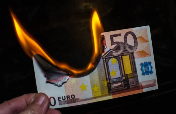 depositphotos_176409524-stock-photo-burning-fifty-euro